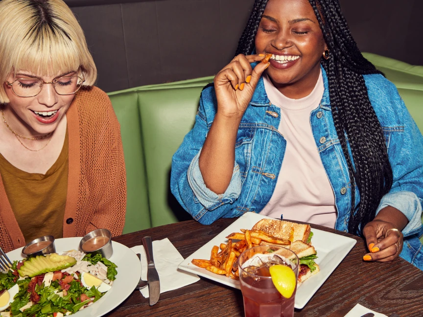 Two women eating dinner